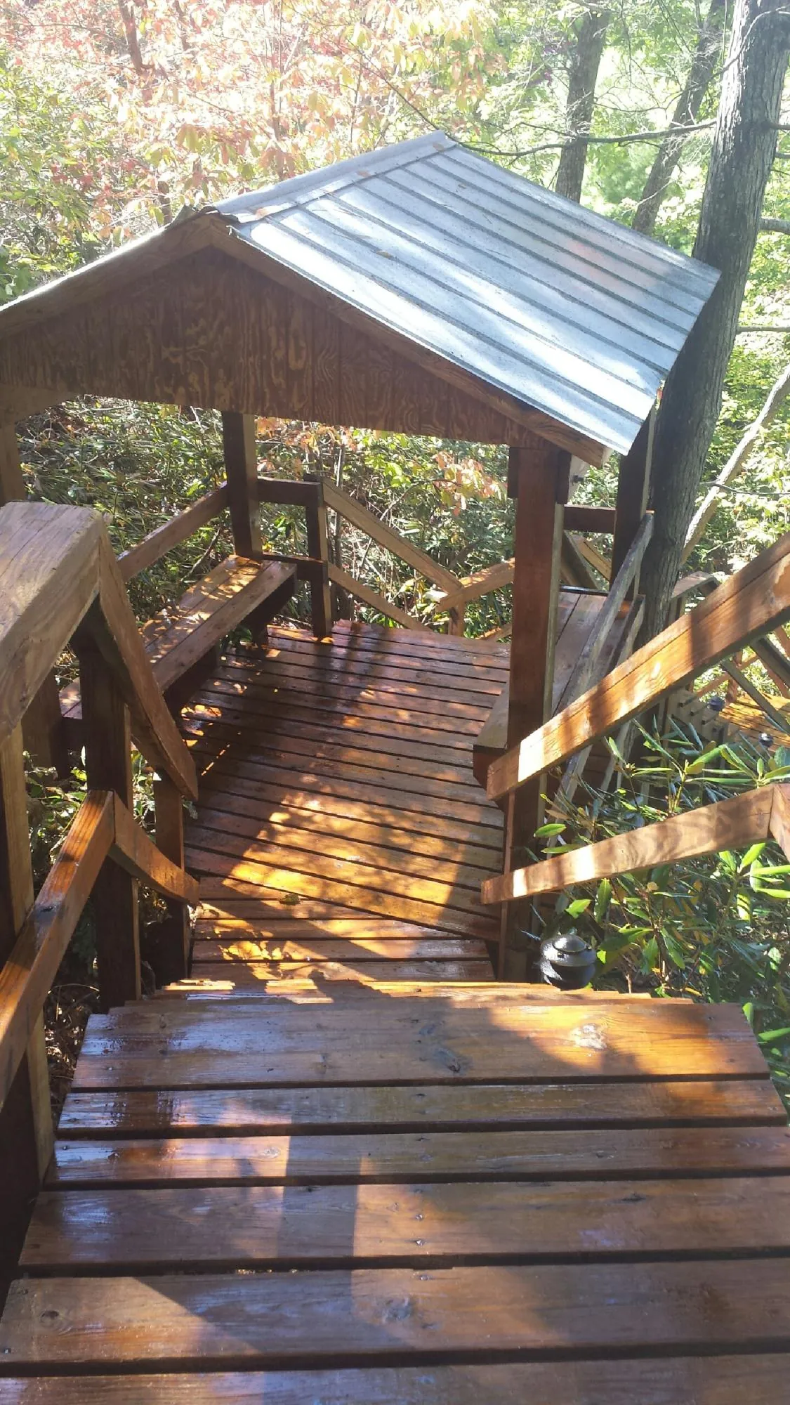 Freshly stained wood walkway and covered shelter with a metal roof in Nyssa